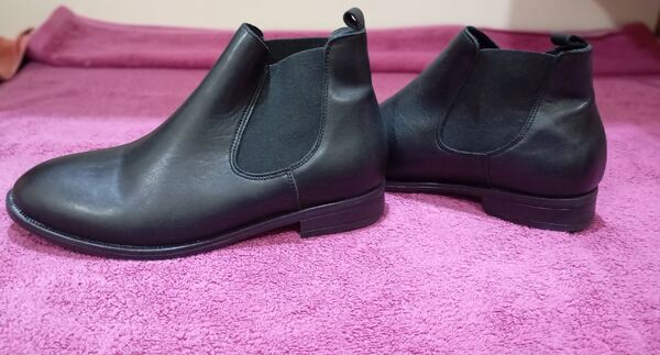 botas ou botins. Botas e botins