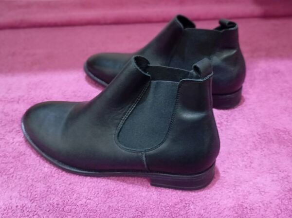 botas ou botins. Botas e botins